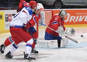 OSTRAVA, CZECH REPUBLIC - MAY 1: Norway's Lars Volden #31 reaches for a bouncing puck against Team Russia during preliminary round action at the 2015 IIHF Ice Hockey World Championship. (Photo by Richard Wolowicz/HHOF-IIHF Images)

