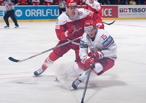 OSTRAVA, CZECH REPUBLIC - MAY 5: Belarus' Artyom Demkov #15 reaches for the puck with pressure from Denmark's Emil Kristensen #28 during preliminary round action at the 2015 IIHF Ice Hockey World Championship. (Photo by Richard Wolowicz/HHOF-IIHF Images)

