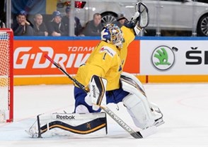 PRAGUE, CZECH REPUBLIC - MAY 7: Sweden's Jhonas Enroth #1 reaches out in attempt to make a glove save during preliminary round action against Germany at the 2015 IIHF Ice Hockey World Championship. (Photo by Andre Ringuette/HHOF-IIHF Images)

