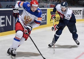 OSTRAVA, CZECH REPUBLIC - MAY 10: Russia's Nikolai Kulyomin #41 stickhandles the puck away from Slovakia's Juraj Mikus #26 during preliminary round action at the 2015 IIHF Ice Hockey World Championship. (Photo by Richard Wolowicz/HHOF-IIHF Images)

