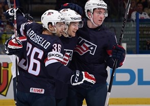 OSTRAVA, CZECH REPUBLIC - MAY 12: USA's Ben Smith #12 celebrates with Mark Arcobello #36 and Jimmy Vesey #19 after scoring Team USA's first goal of the game during preliminary round action at the 2015 IIHF Ice Hockey World Championship. (Photo by Richard Wolowicz/HHOF-IIHF Images)


